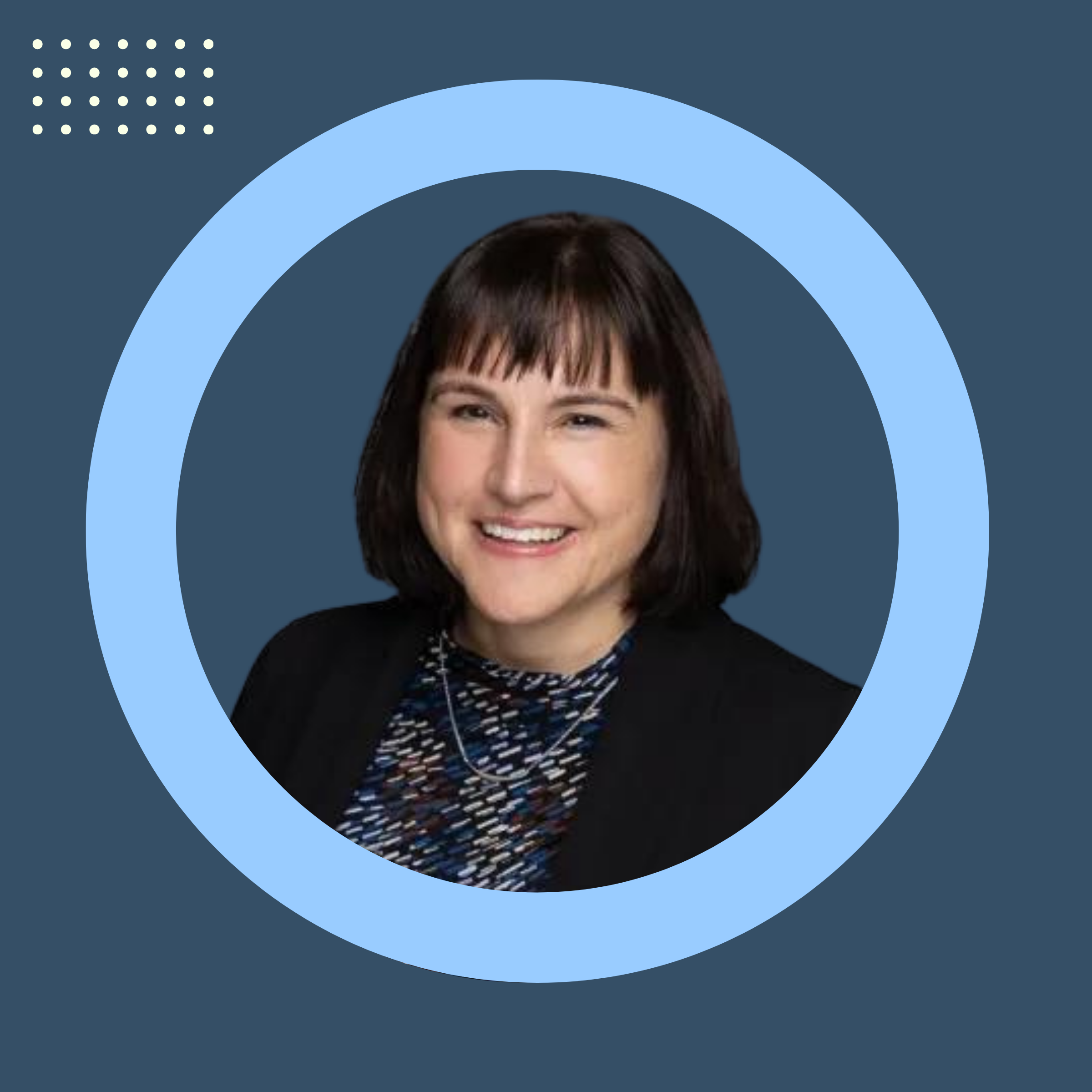 A headshot of a woman with straight dark hair cut into a bob shape with bangs, smiling. She is wearing a patterned top with a black blazer, set against a blue background with light blue half circle around her. In the top left 4x7 dots in a rectangle shape are also shown.